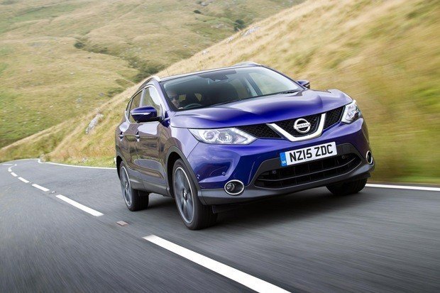 blue nissan qashqai driving on country road