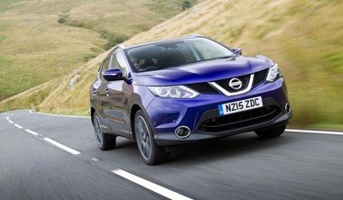 blue nissan qashqai driving on country road