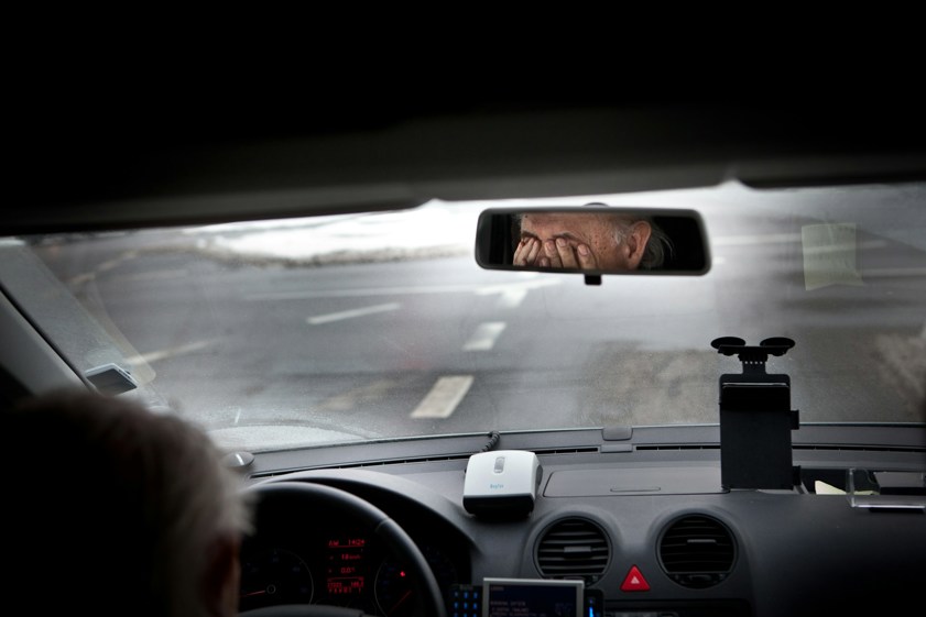 Tired taxidriver rubbing his eyes driver fatigue road