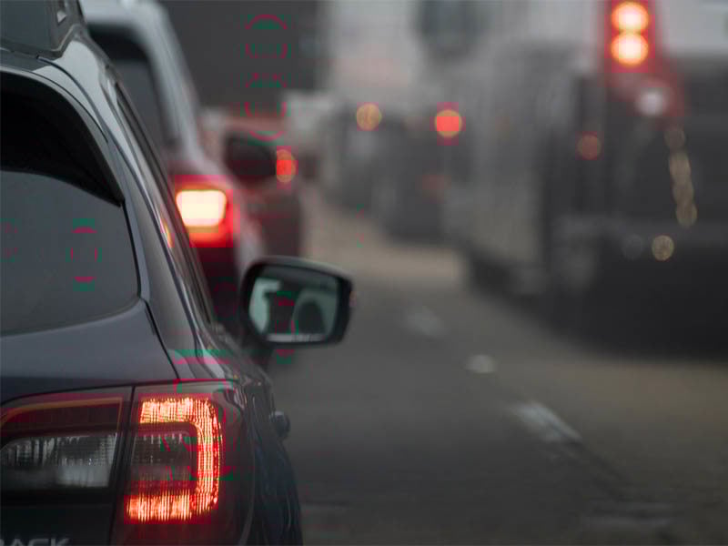 Car stuck in traffic with rear brake lights on