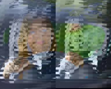 young woman driving car