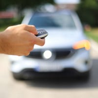 man holding car keys
