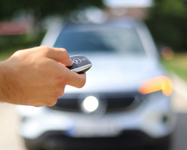 man holding car keys