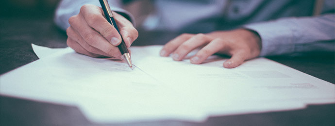 Man signing a contract agreement