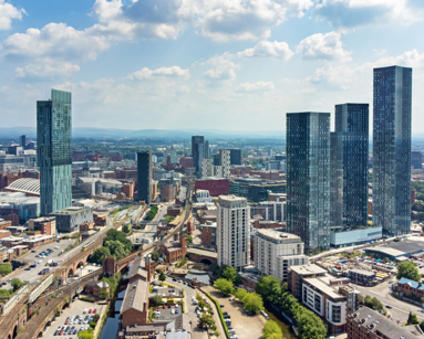 Wide angle aerial view of the skyline of Manchester, England, UK