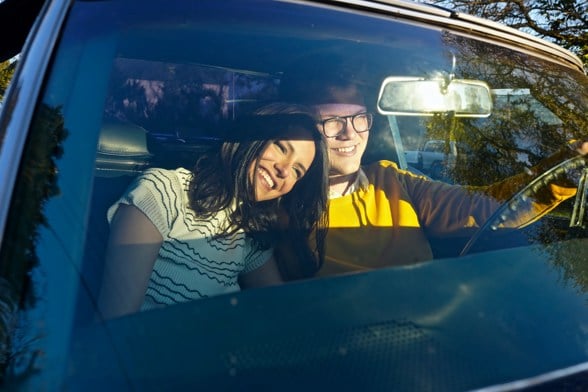 a man and woman sat in a car