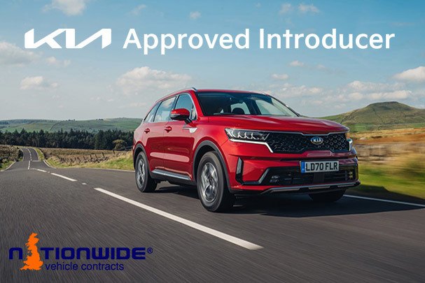 A Kia Sportage driving on the road with a badge for Kia Approved Introducer.