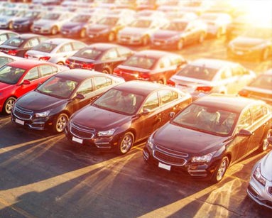 rows of cars in car forecourt