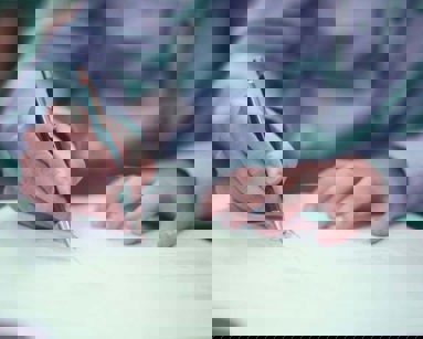 close up of man signing documents