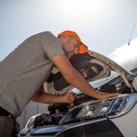 Mechanic taking care of broken van