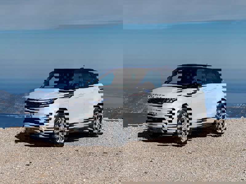 white range rover evoque on mountain road