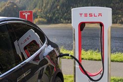 tesla charging a tesla supercharger network