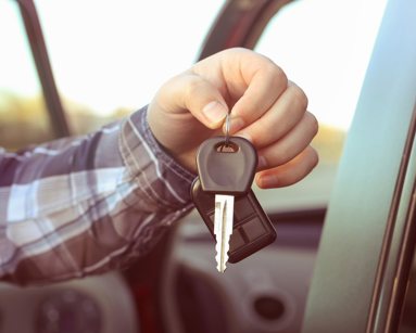 man holding van key
