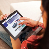 woman looking at car leasing company on tablet