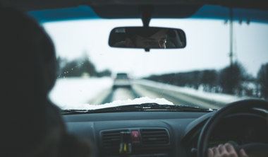 man driving in snowy conditions