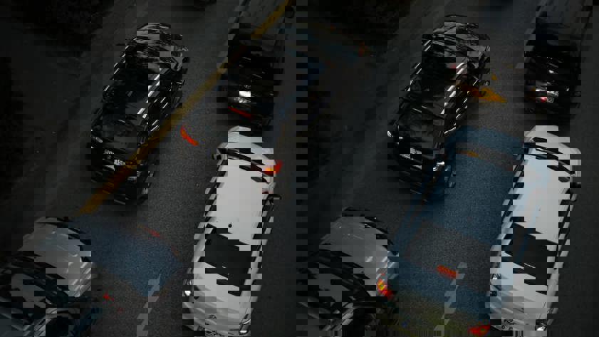 Black and white cars in traffic
