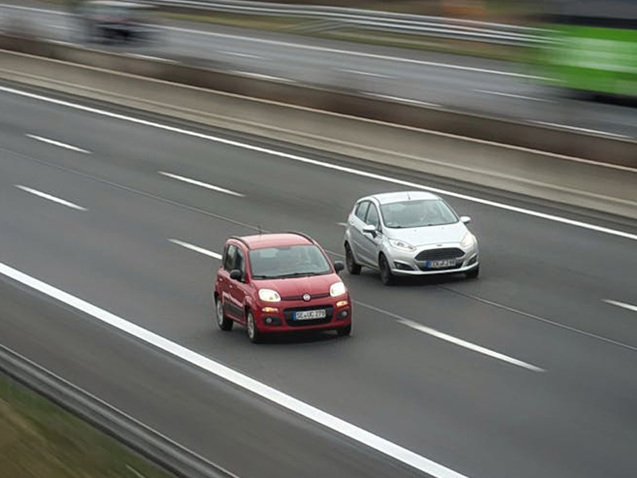 Cars driving next to each other on a motorway