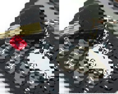 car key on top of calculator