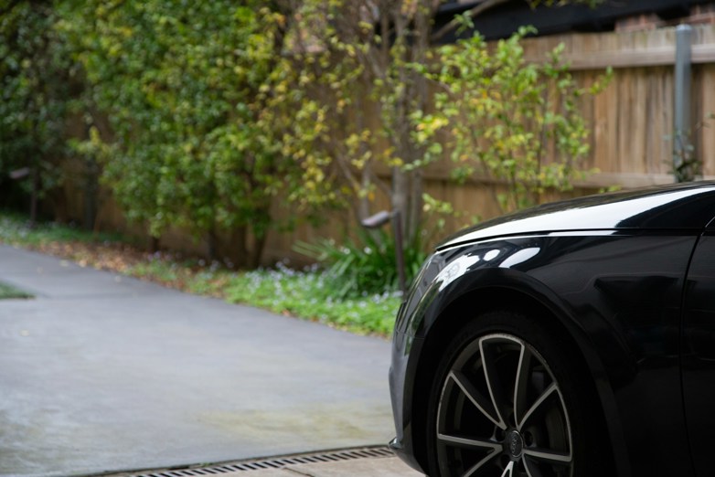 Black car parked on a driveway