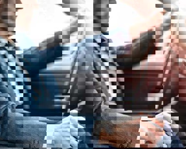 close up of businessman driving a car