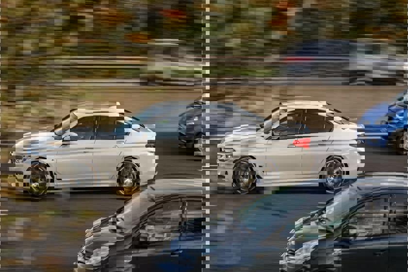 BMW saloon car driving on a motorway