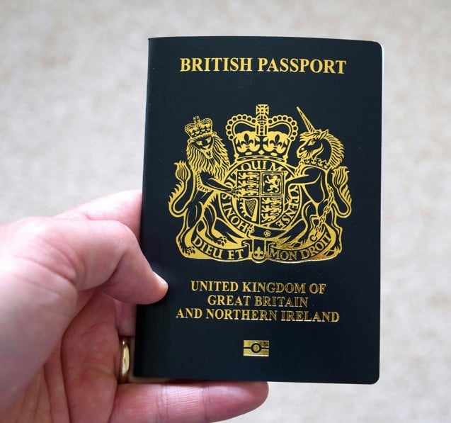 man holding a British passport