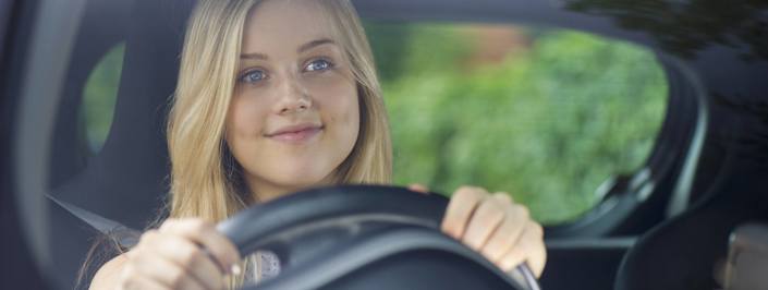 young woman driving car