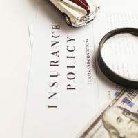 A magnifying glass sitting on a piece of paper