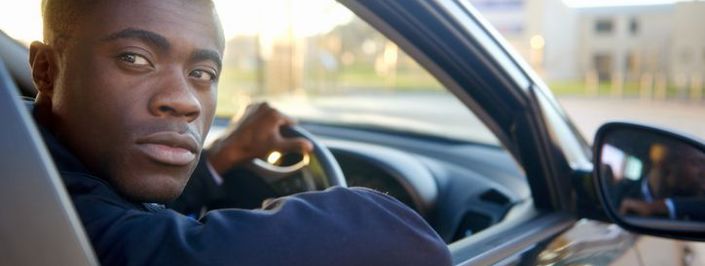 young man reversing car