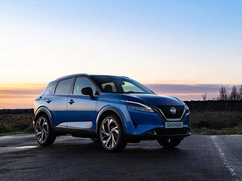 Blue Nissan Qashqai at sunset