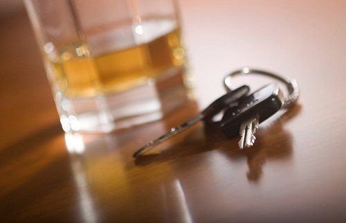 Car keys next to a pint. Dont Drink and Drive