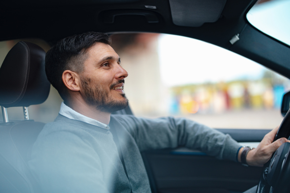 Handsome Businessman Driving His Car