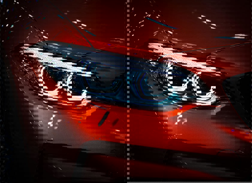 red car with headlights