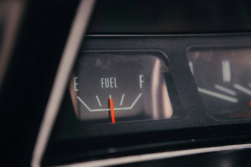 close-up of a cars fuel gauge showing empty