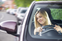 Young woman driving her car