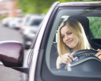 Young woman driving her car