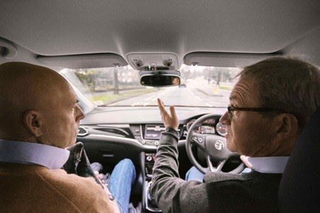Harry Enfield and Dylan Jones chat in a Vauxhall Astra