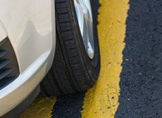 car parked on yellow lines