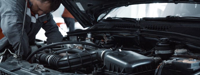 mechanic servicing a car