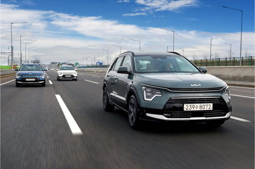Kia Niro driving on a motorway with a car behind