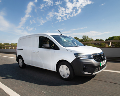 Nissan Townstar in white driving on the road