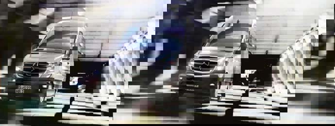 silver mercedes-benz sprinter driving on the road