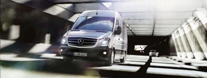 silver mercedes-benz sprinter driving on the road