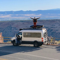 man standing on top of van