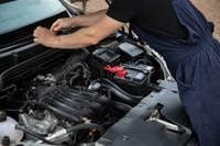 Mechanic fixing a car engine