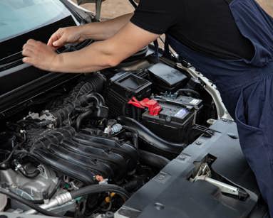 Mechanic fixing a car engine