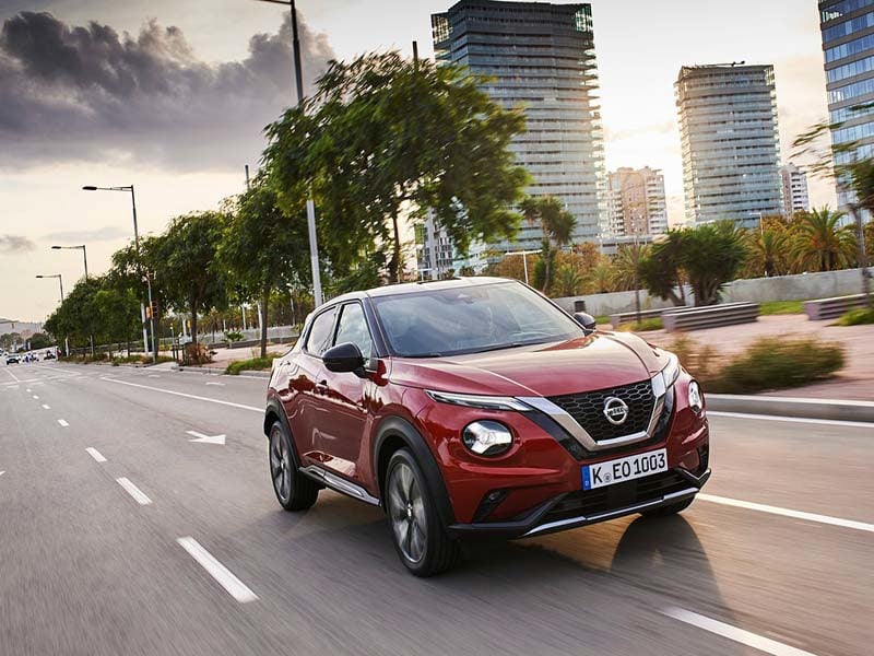 Red Nissan Juke on a city street