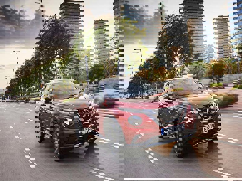 Red Nissan Juke on a city street