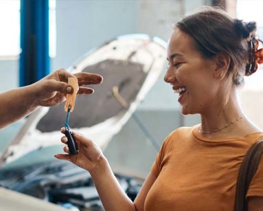 Shot of a woman receiving her car keys