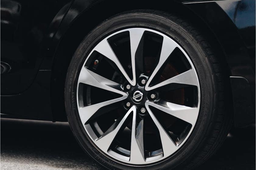Nissan car with silver alloy wheels